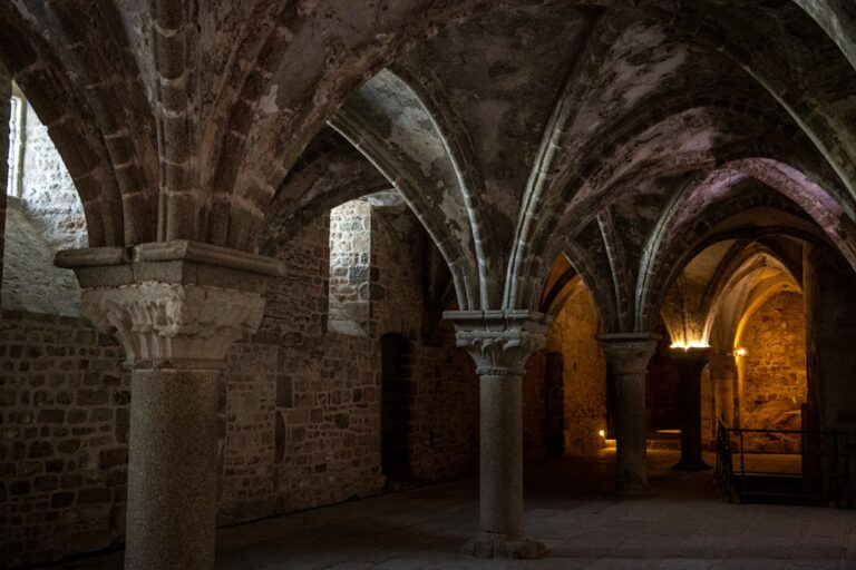 How to Reduce Waste While Traveling in Dubrovnik โ Travel Guide to Dubrovnik 141 a dimly lit room with stone arches and pillars