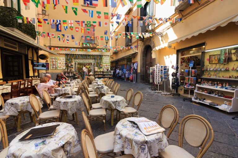 Avoid Tourist Scams in Dubrovnik: What to Watch Out For โ Travel Guide to Dubrovnik 53 a group of people sitting at tables in a restaurant