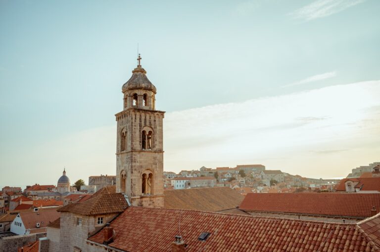 a tall tower with a clock on top of a building