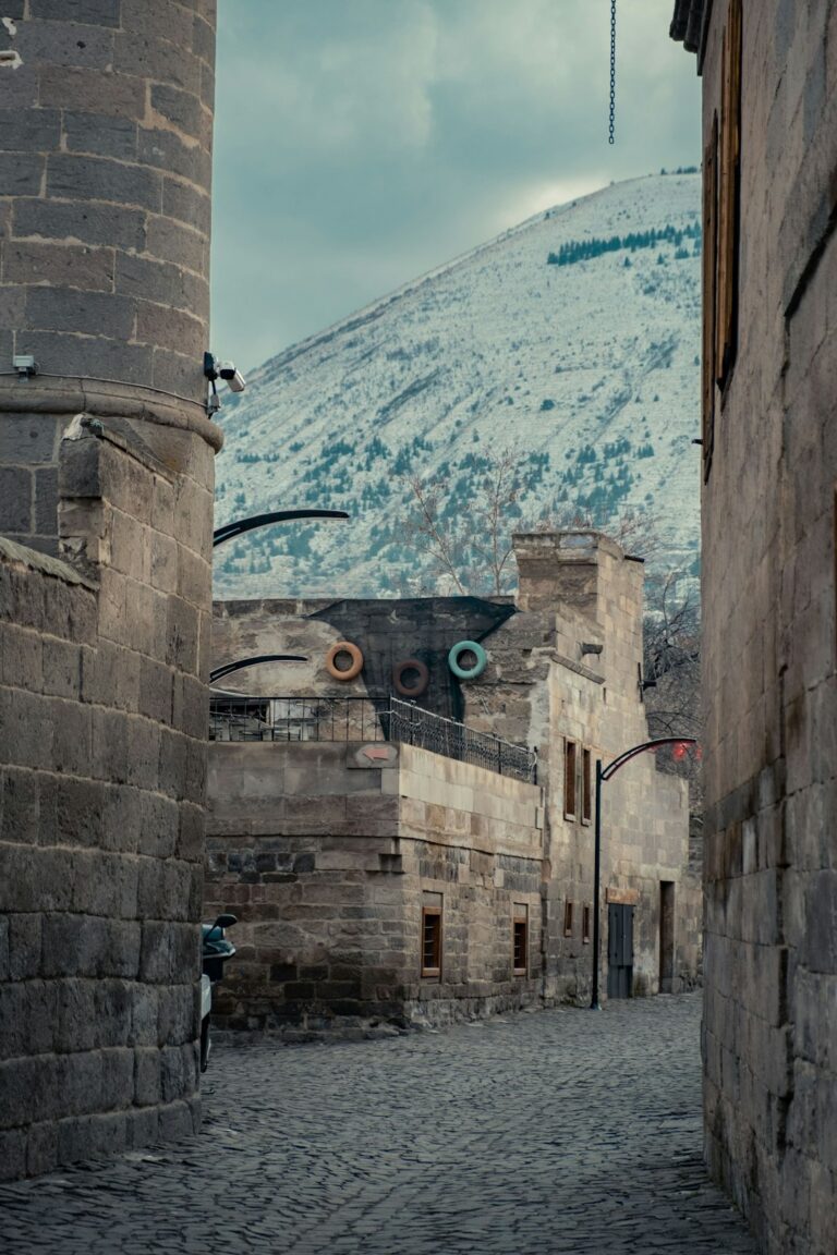 Sustainable Packing List for a Trip to Dubrovnik โ Travel Guide to Dubrovnik 89 an alley way with a mountain in the background