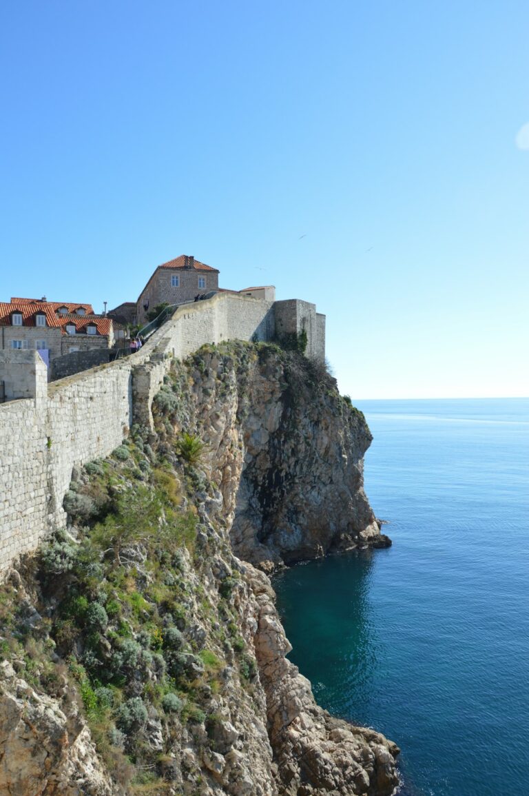Explore the captivating beauty of Dubrovnik's historic walls and fortress overlooking the serene Adriatic Sea, a mesmerizing blend of ancient architecture and coastal splendor.